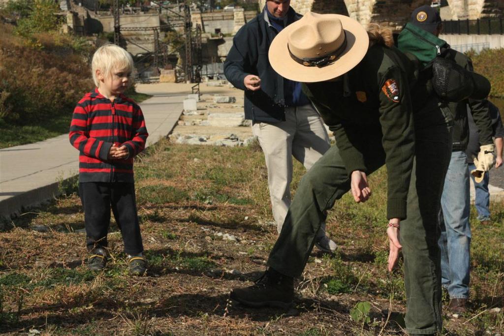 park ranger sarah keefer demonstrates seed broadcasting to aiche